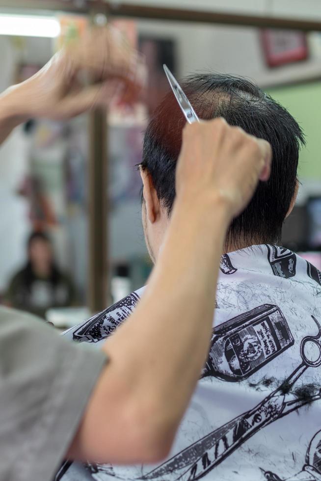 Barber hand with the back of the head. photo