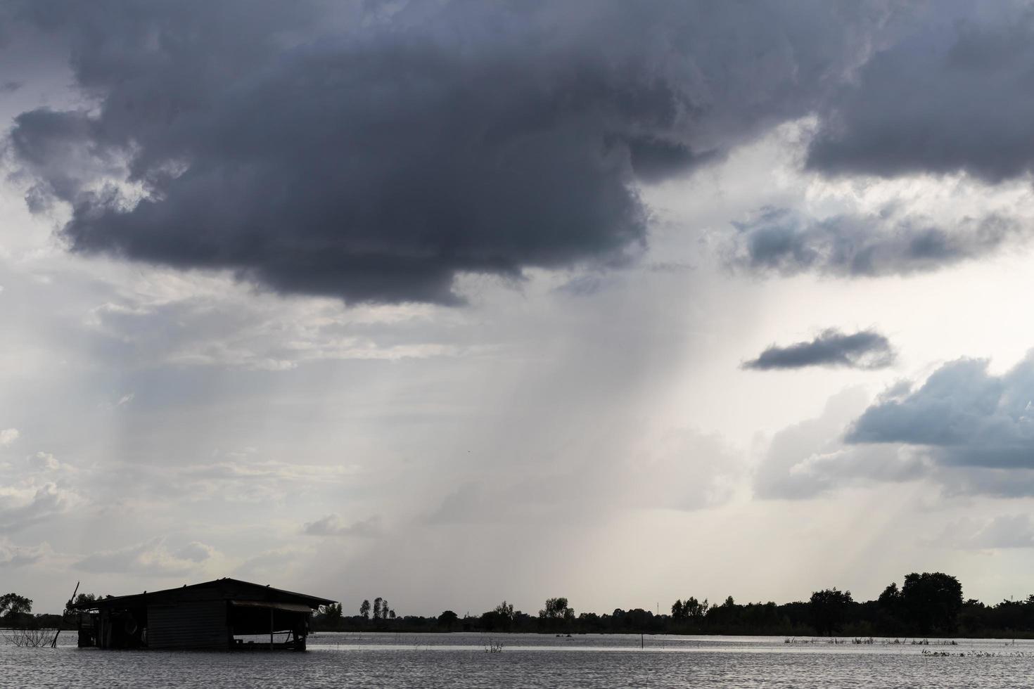 Dark clouds over the old cottage. photo