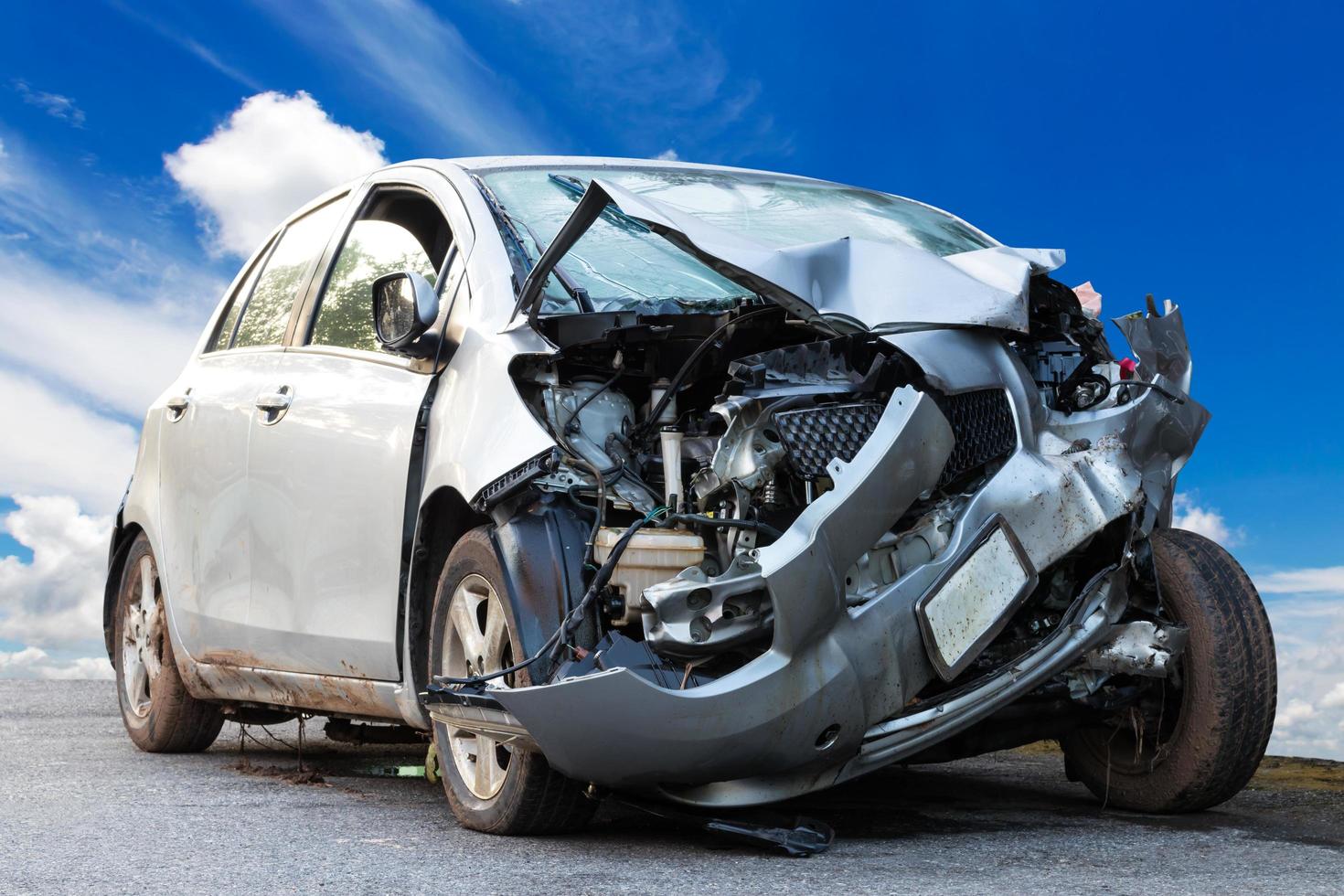 Car demolished with sky clouds. photo