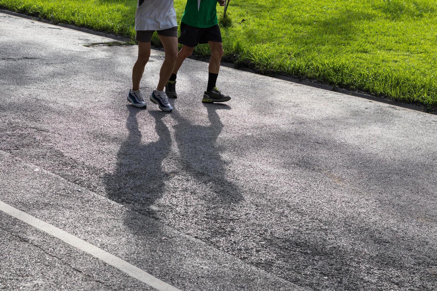 Shadow people running on the street. photo