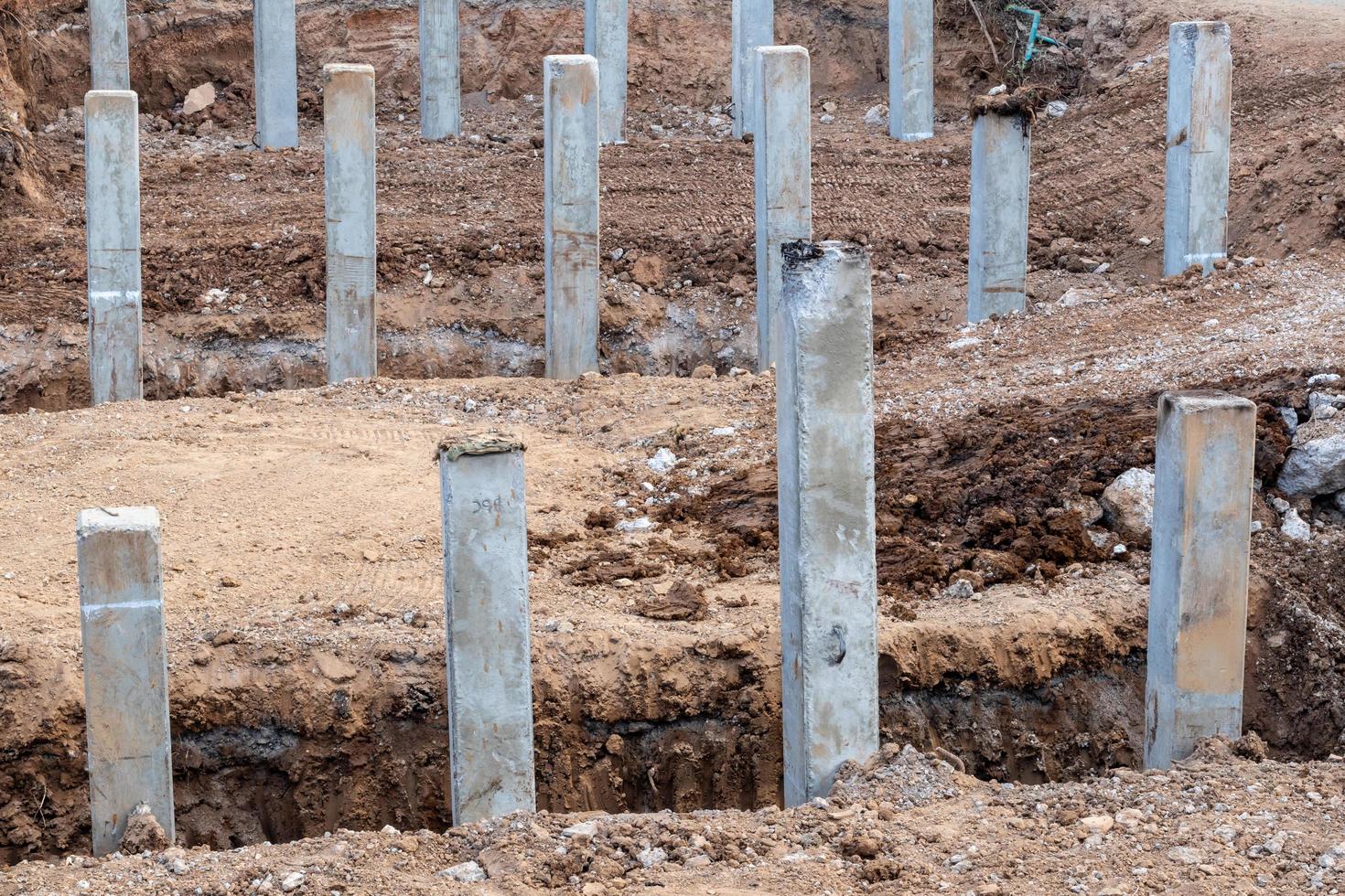 Many concrete in the trench dug soil. photo