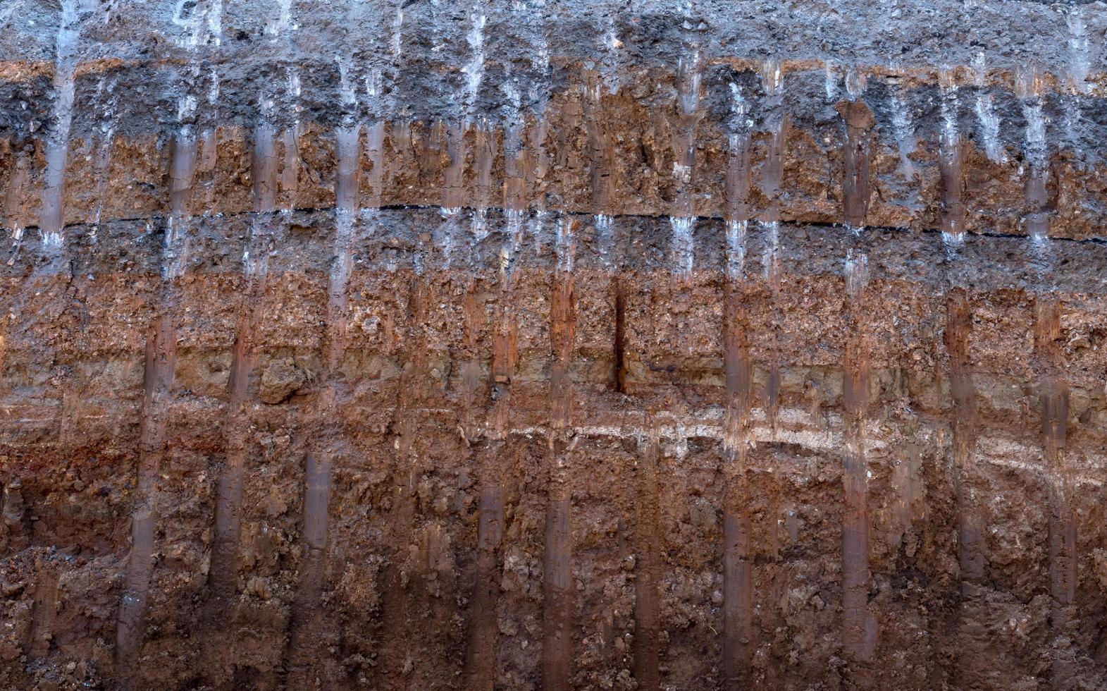 Soil surface, gravel under the paved road was excavated. photo