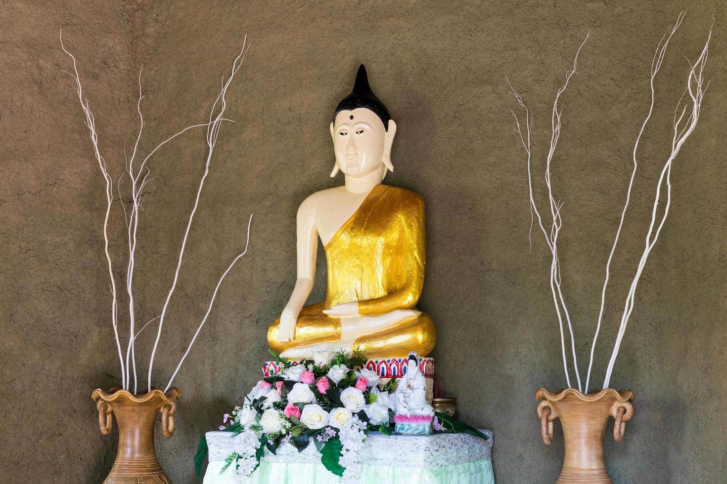Statue of Buddha with rough cement wall. 7519347 Stock Photo at Vecteezy