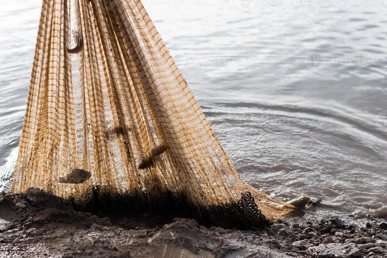 Fish net catching near clay. photo