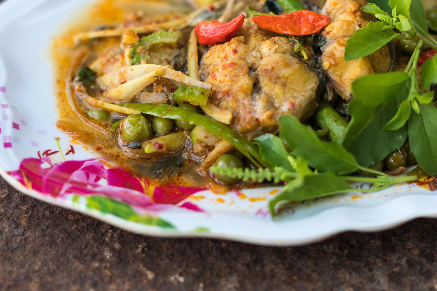 Curry catfish on rust. photo