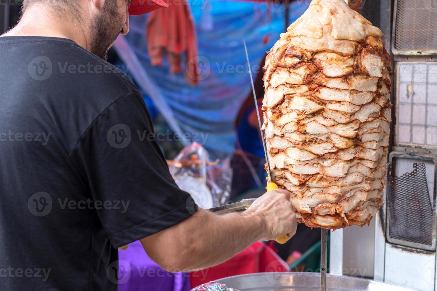 Kebab was cut by an Arab man. photo