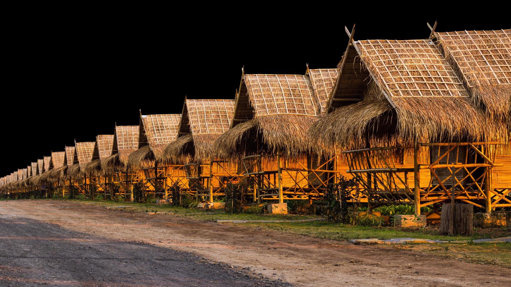 Isolate shacks thatched cottage. photo
