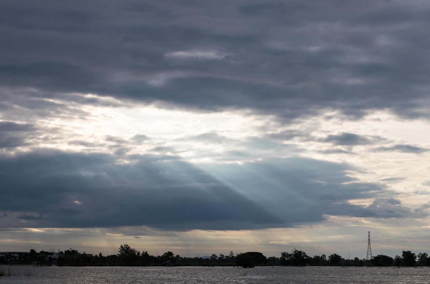 Cloudy with light above the water. photo