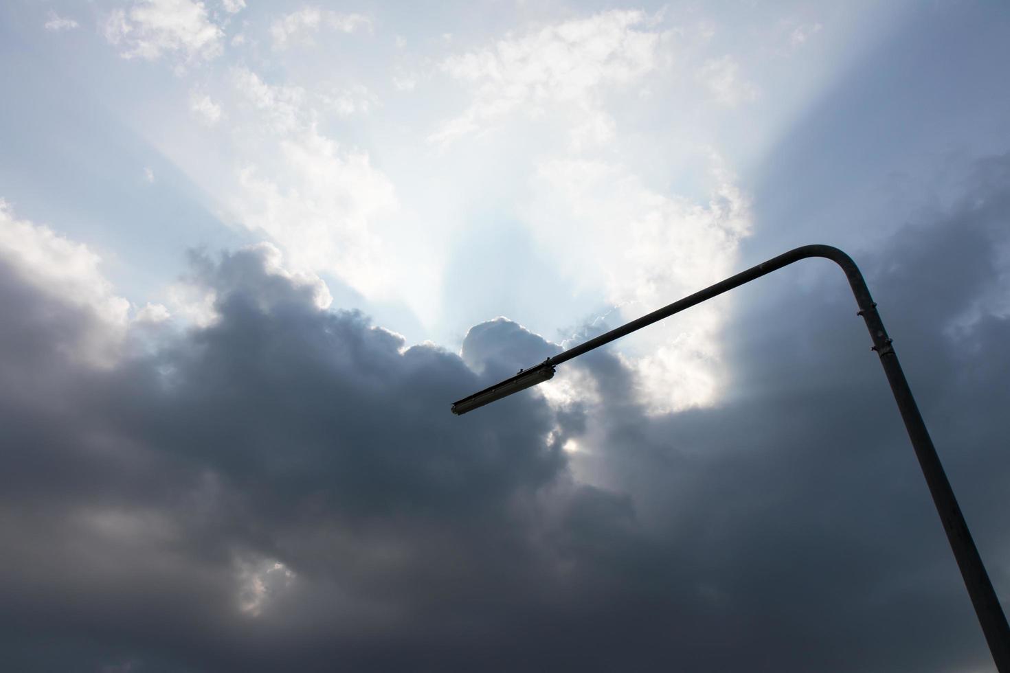 Cloudy with light pole. photo