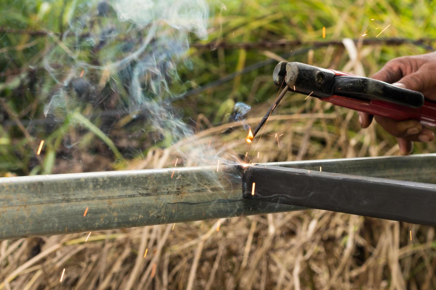 Sparks and smoke welding iron. photo