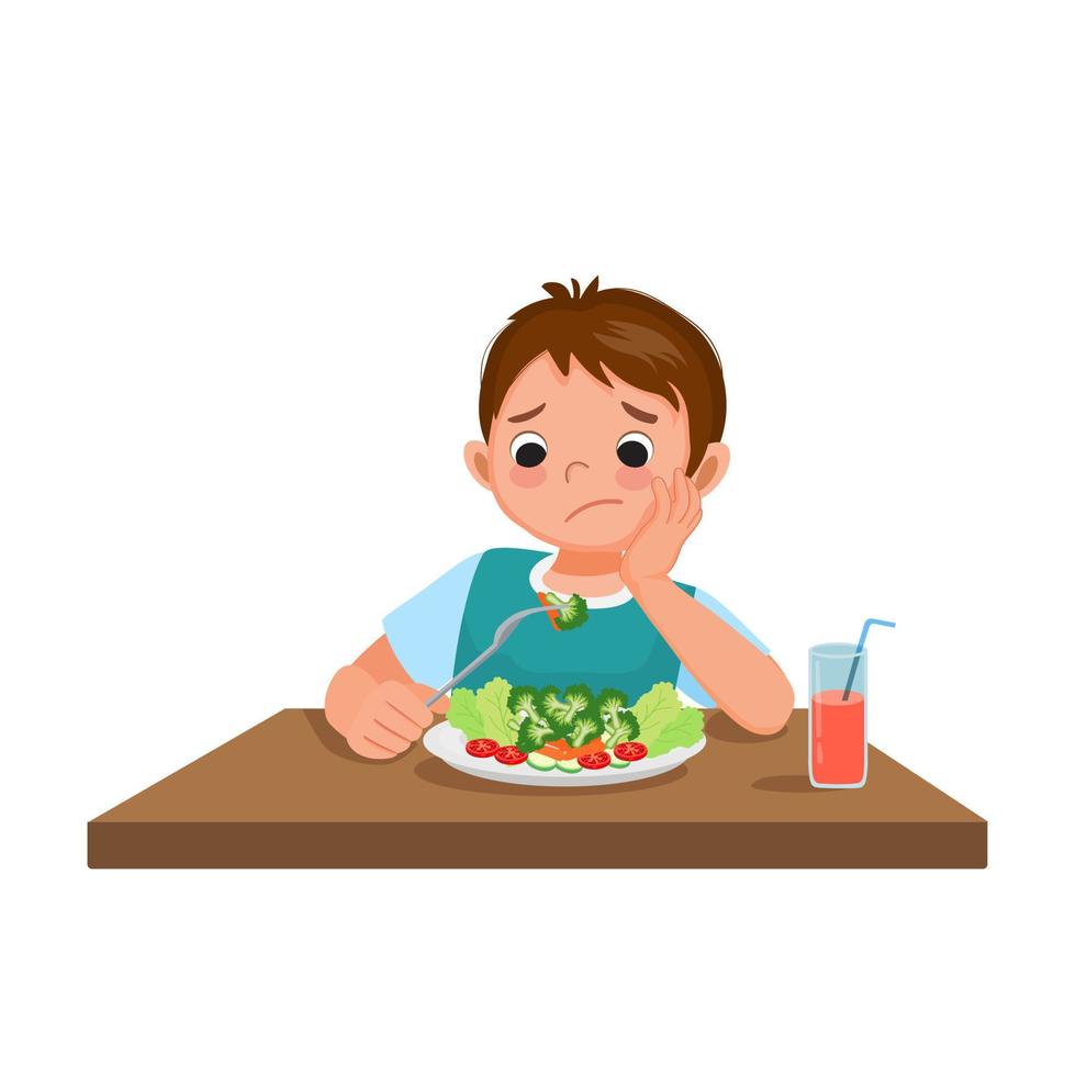 lindo niño quisquilloso frustrante mirando brócoli sin apetito y negándose a comer verduras vector