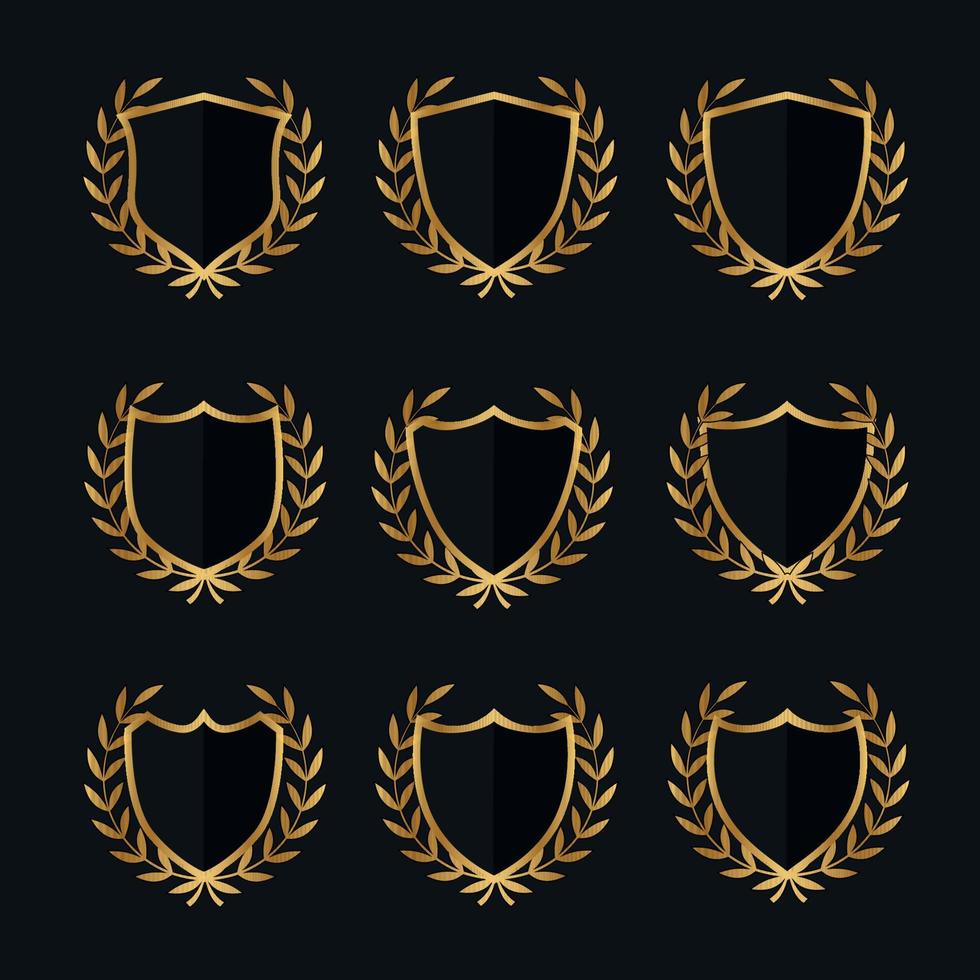 Set of shields with laurels in gold color vector