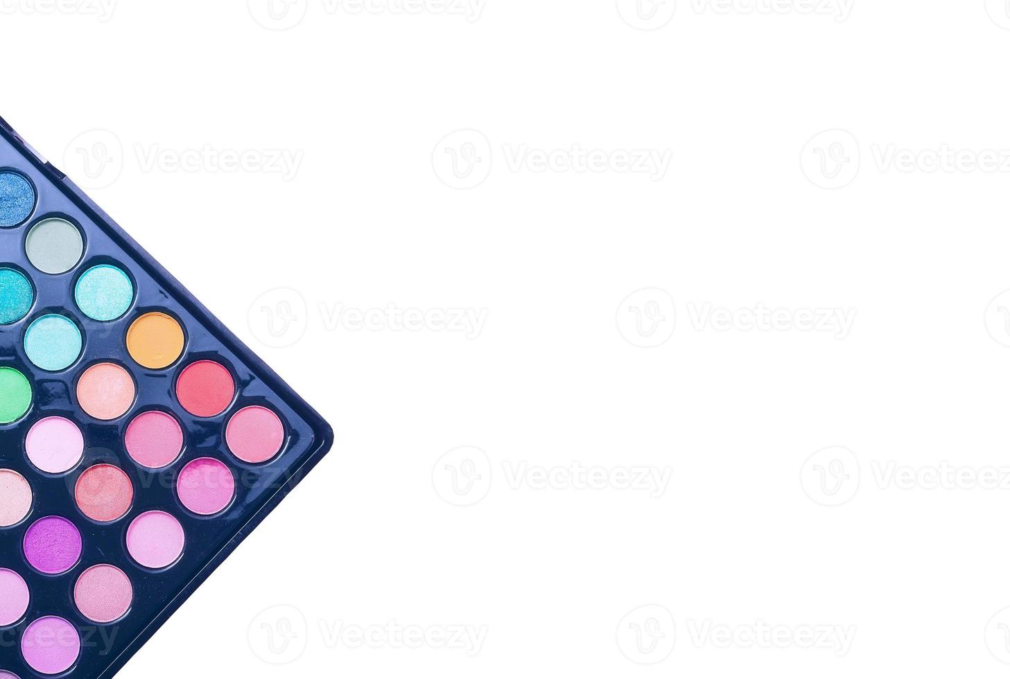 Frame of cosmetic accessories on pink background with copy space. Top view photo