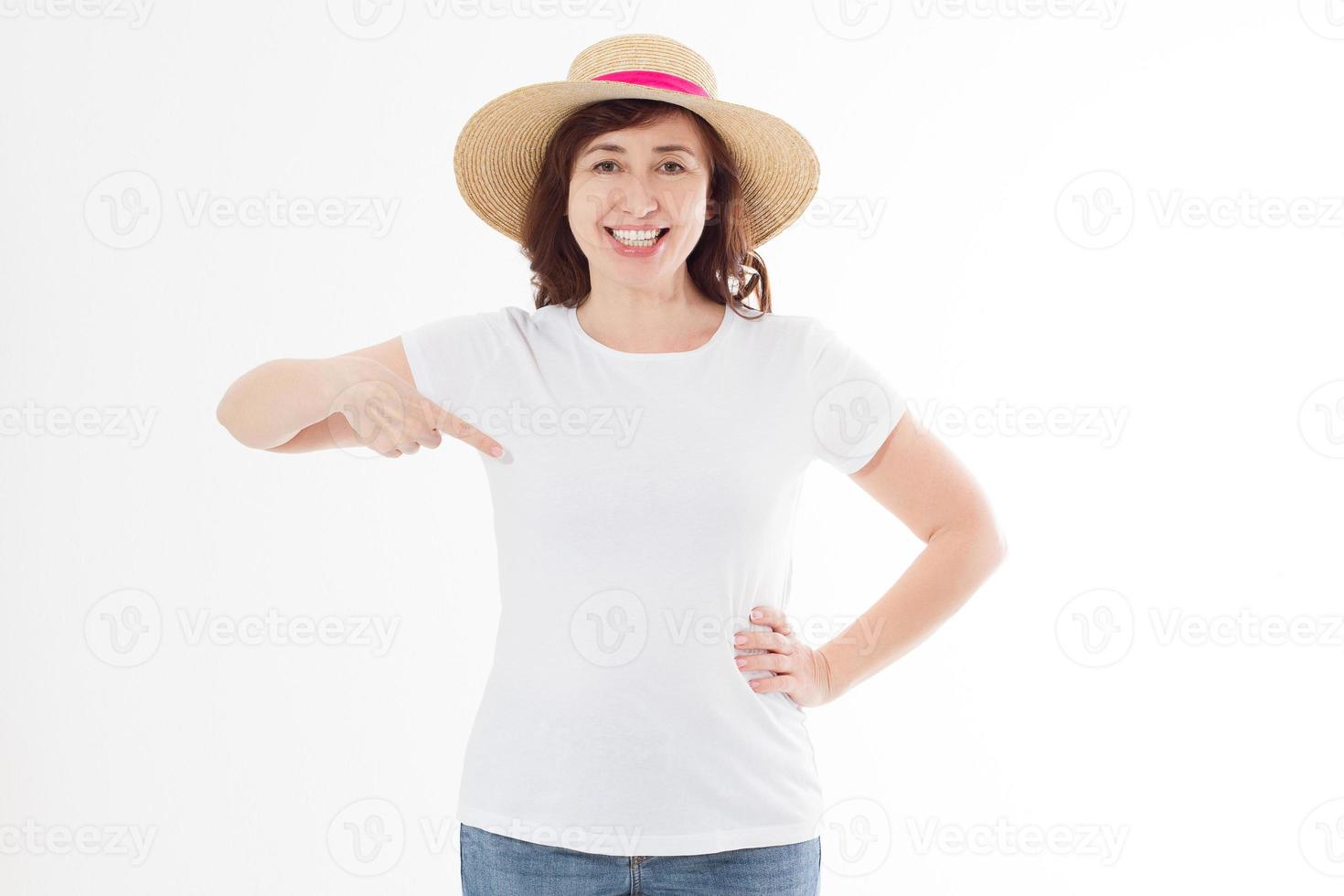 Summer t shirt design and people concept close up of woman in blank template white t-shirt and beach hat point on copy space on white tshirt. Mock up. Front view. photo