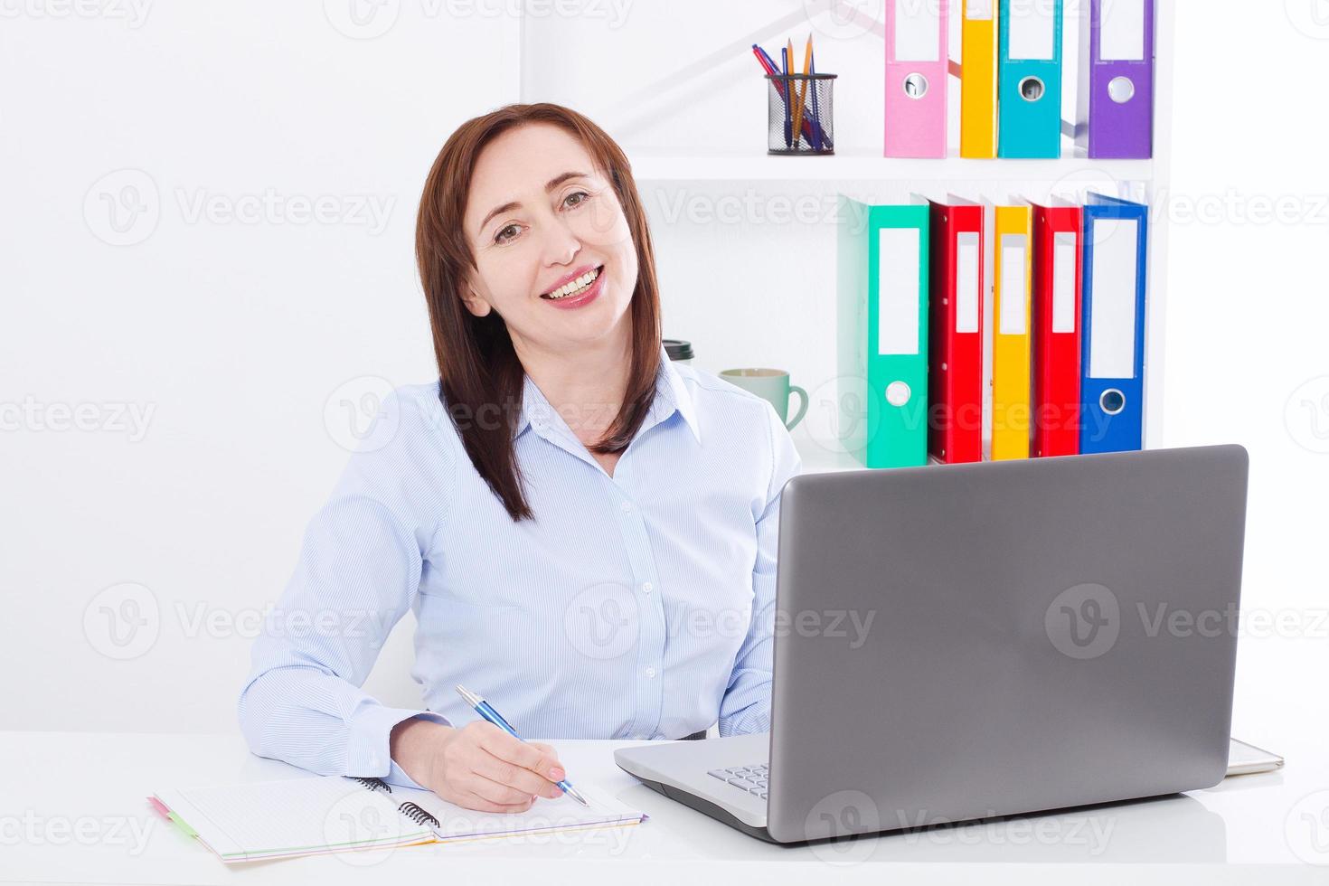 Businesswoman at workplace in office. White background with copy space and mock up. Business success concept photo