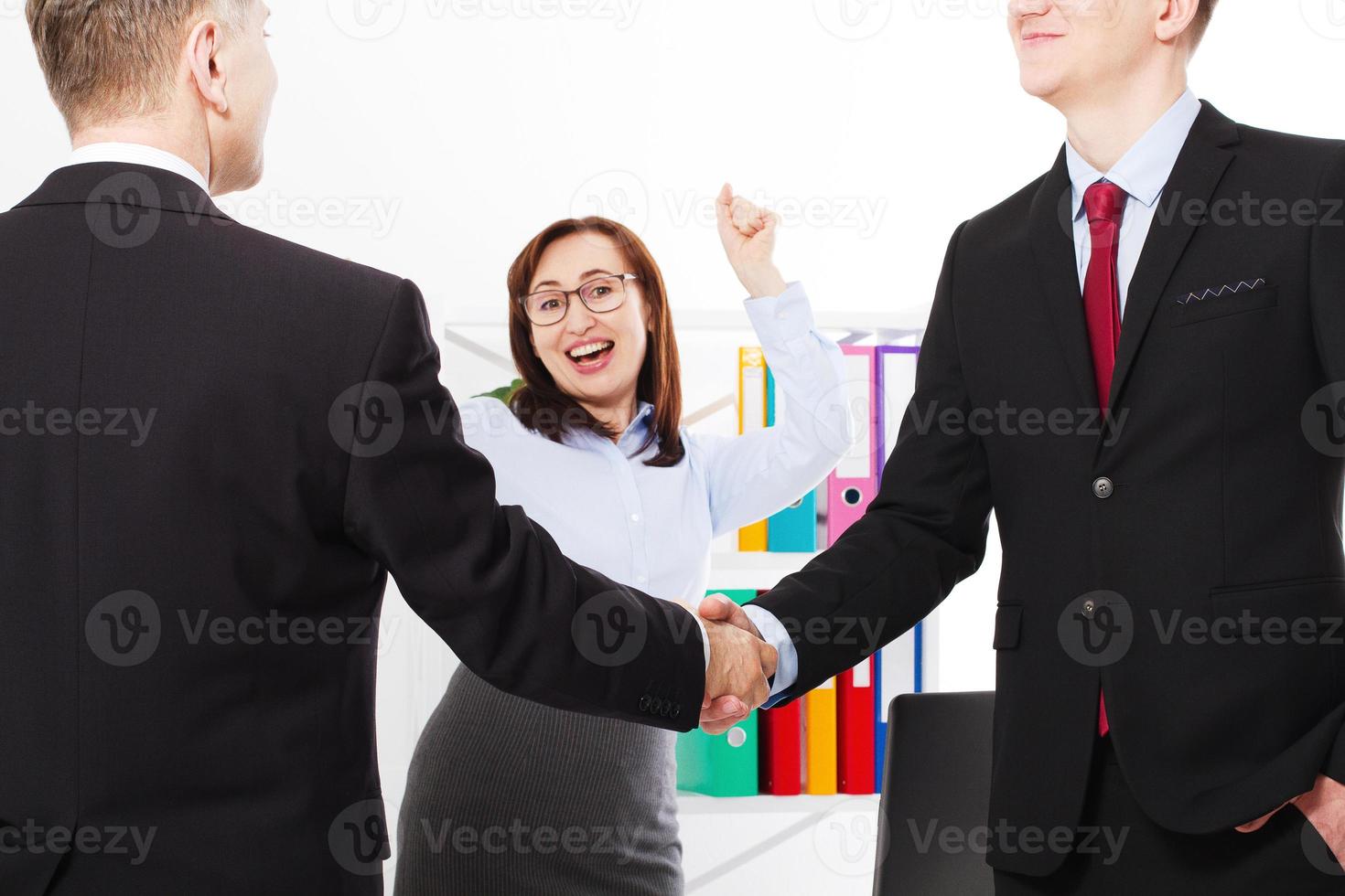 Successful business partnership concept with businessmans handshake. Happy businesswoman at office background. Team work businessmen handshaking after profitable deal. Selective focus. Banner photo