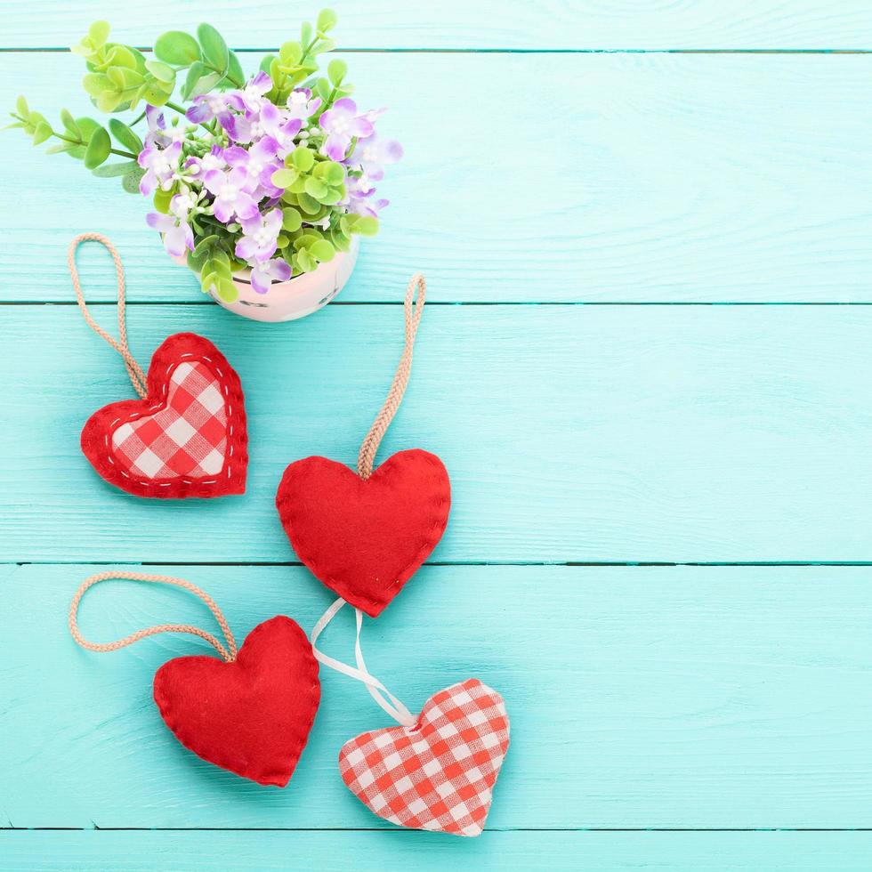 Romantic accessories and copy space on blue wooden background. Top view photo