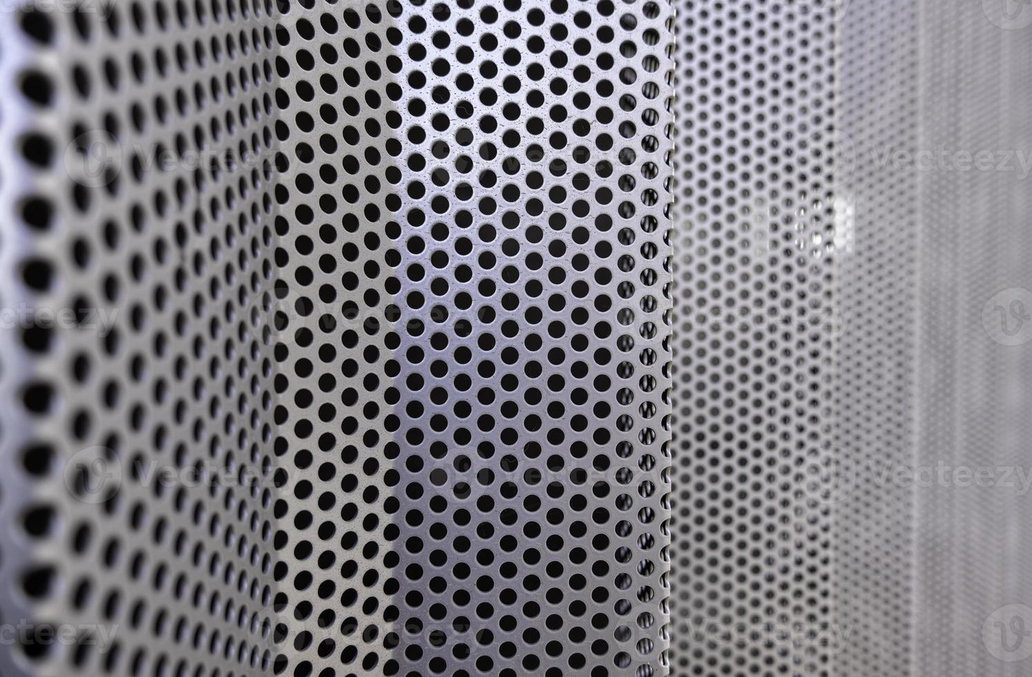 Metal wall with holes photo