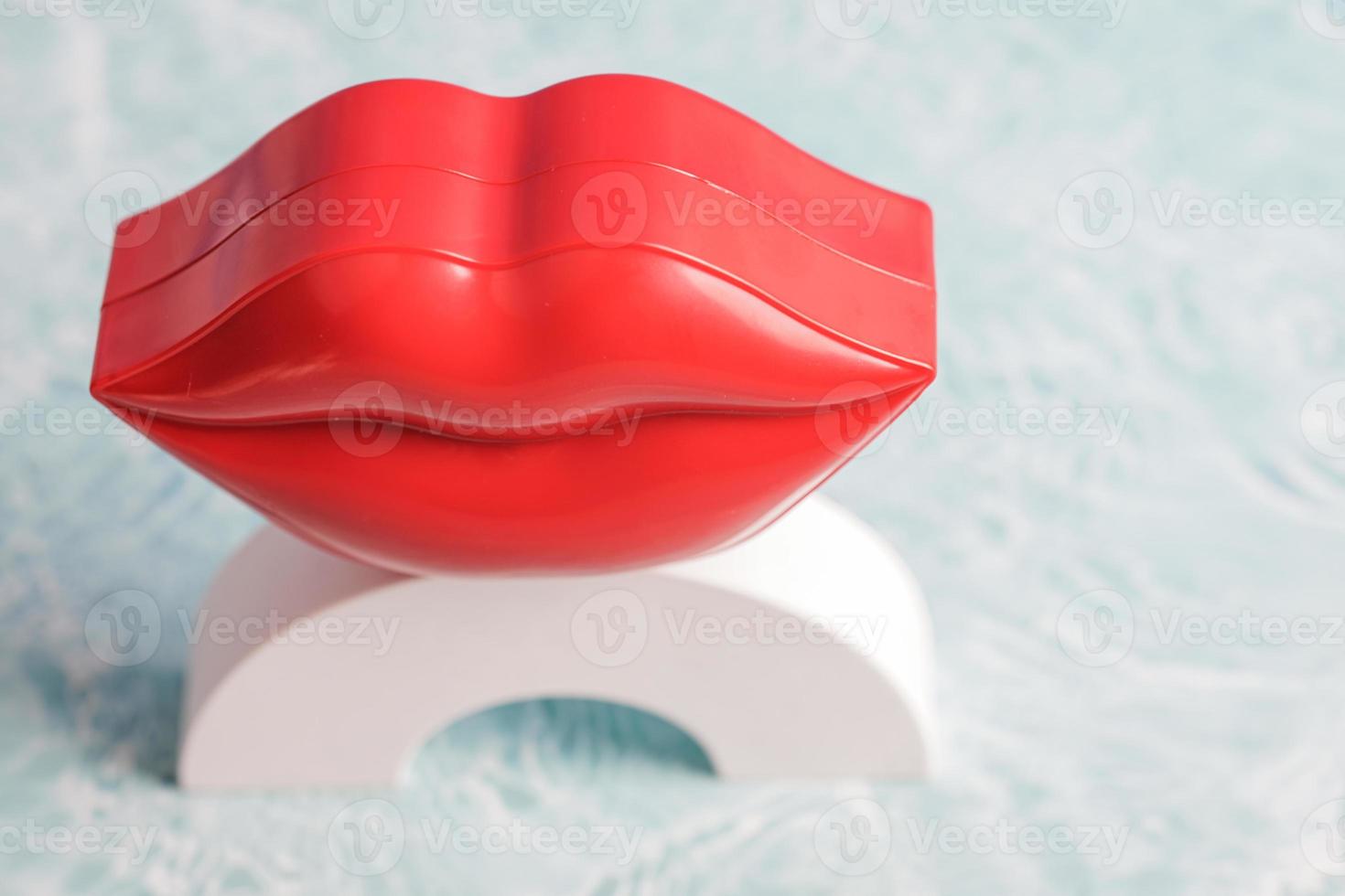 lip, female mouth. Lips with lipstick. Woman's lips close up isolated on water background. photo