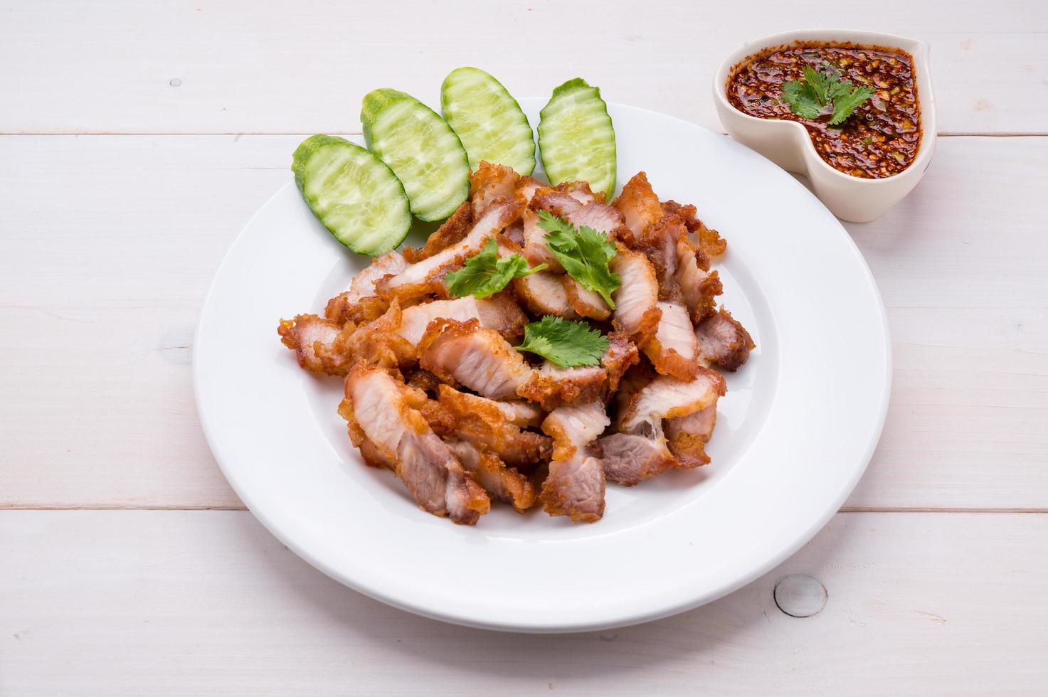 Crispy pork cutlets, ready to eat with fresh vegetables and spicy dipping sauce photo