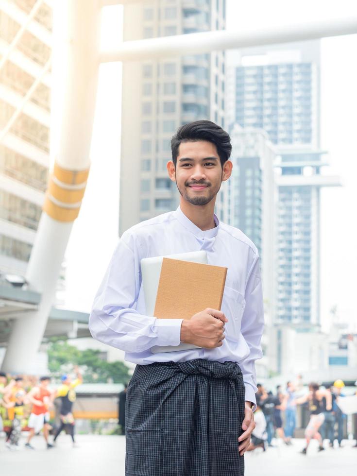 Young Burmese businessman happy after find data in laptop ,It's time to talk about business successful photo