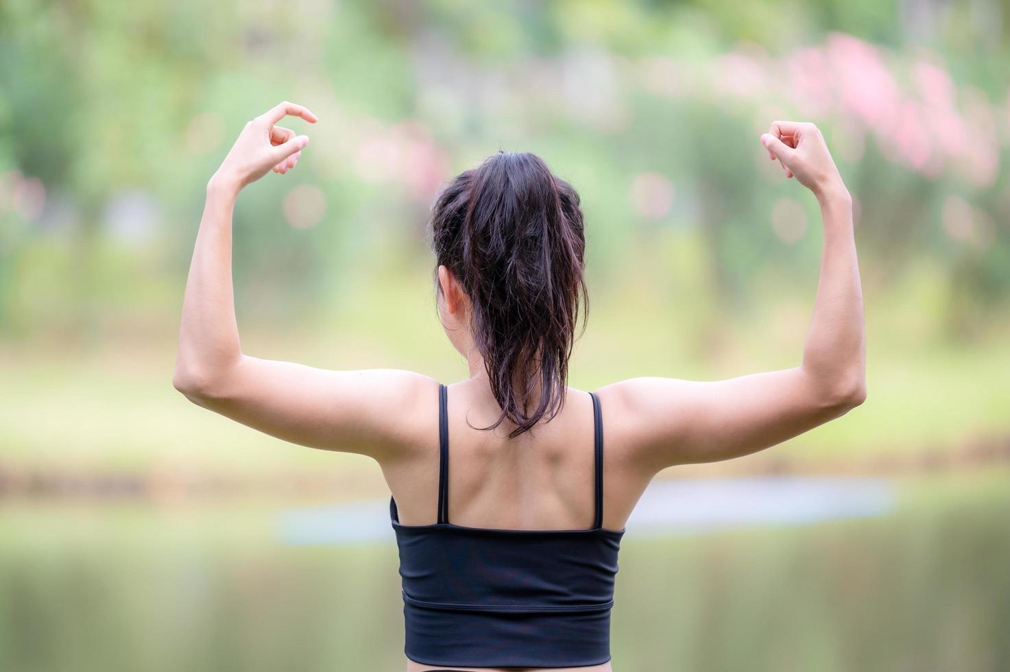 A beautiful Asian woman is warm up, To make the muscles flexible Before going to jogging photo