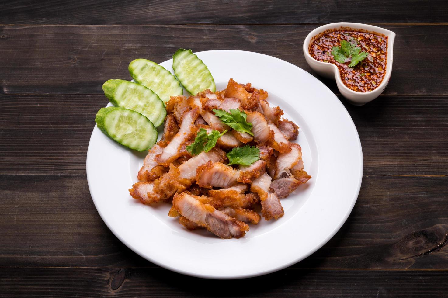 Crispy pork cutlets, ready to eat with fresh vegetables and spicy dipping sauce photo