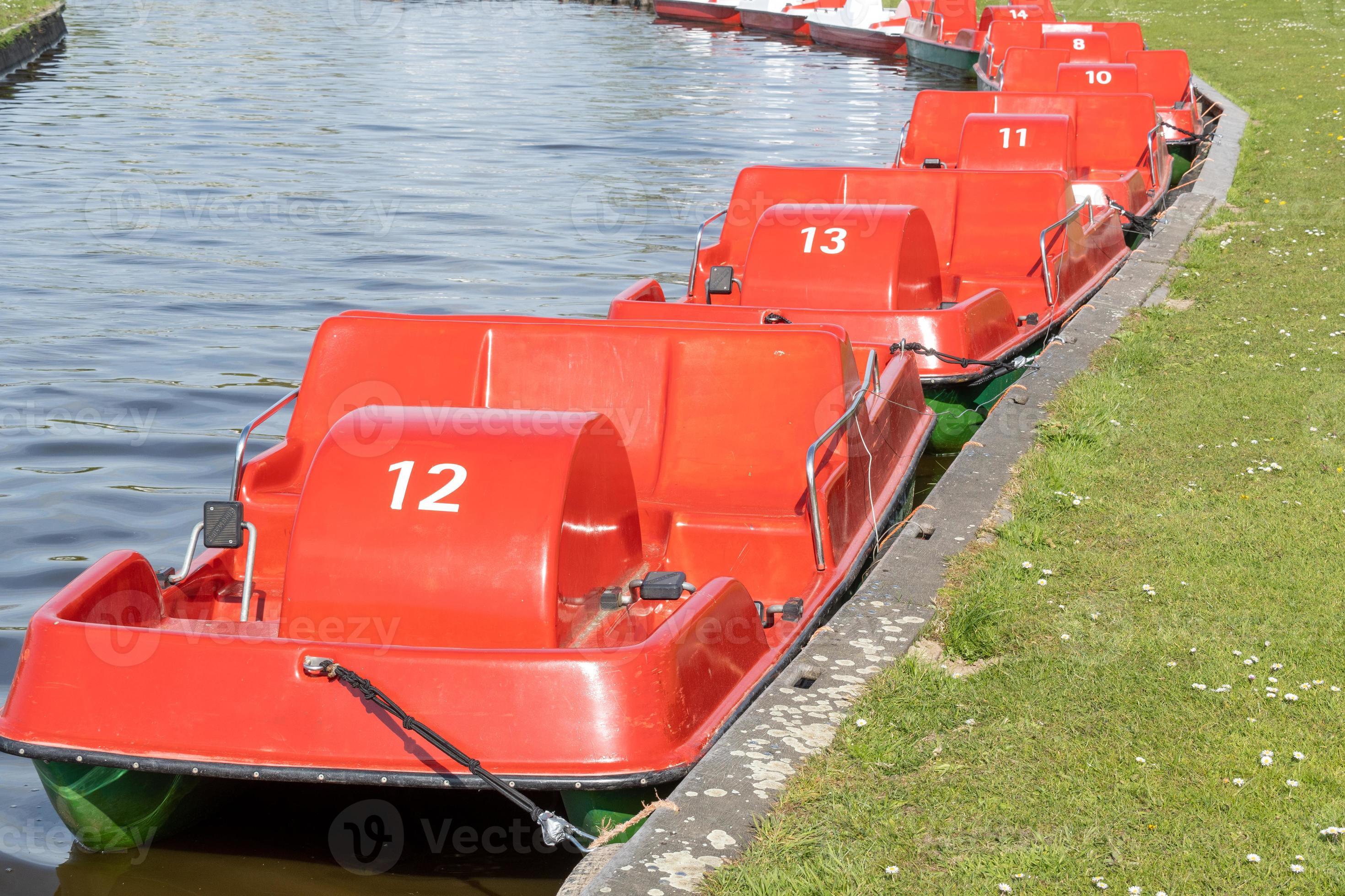 red boats on a river 7542313 Stock Photo at Vecteezy