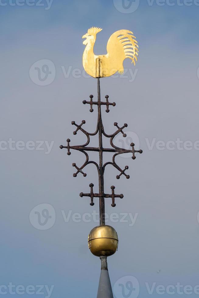 weather vane against sky photo