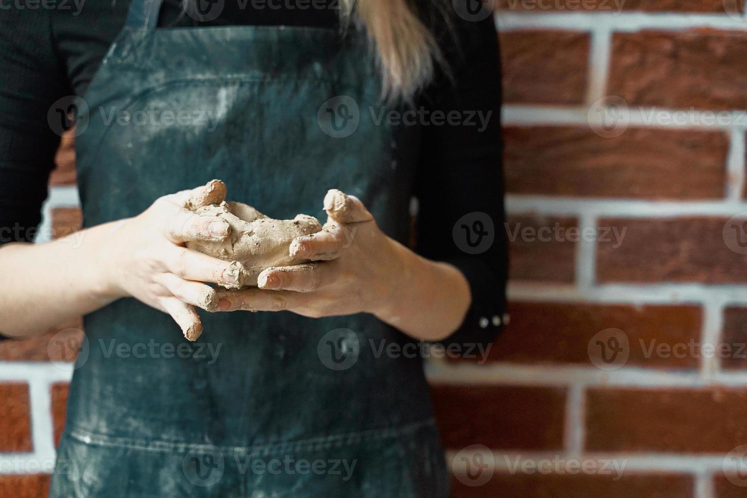Unrecognisable woman making ceramic bowl in hand. Creative hobby concept. Earn extra money, side hustle, turning hobbies into cash, passion into job, copy space photo