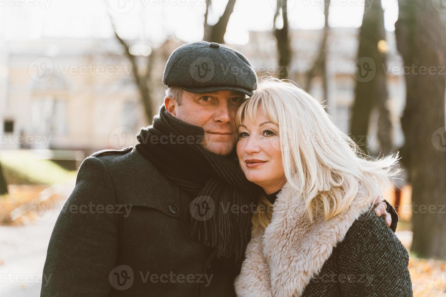 Happy blonde mature woman and handsome middle-aged brunette man photo