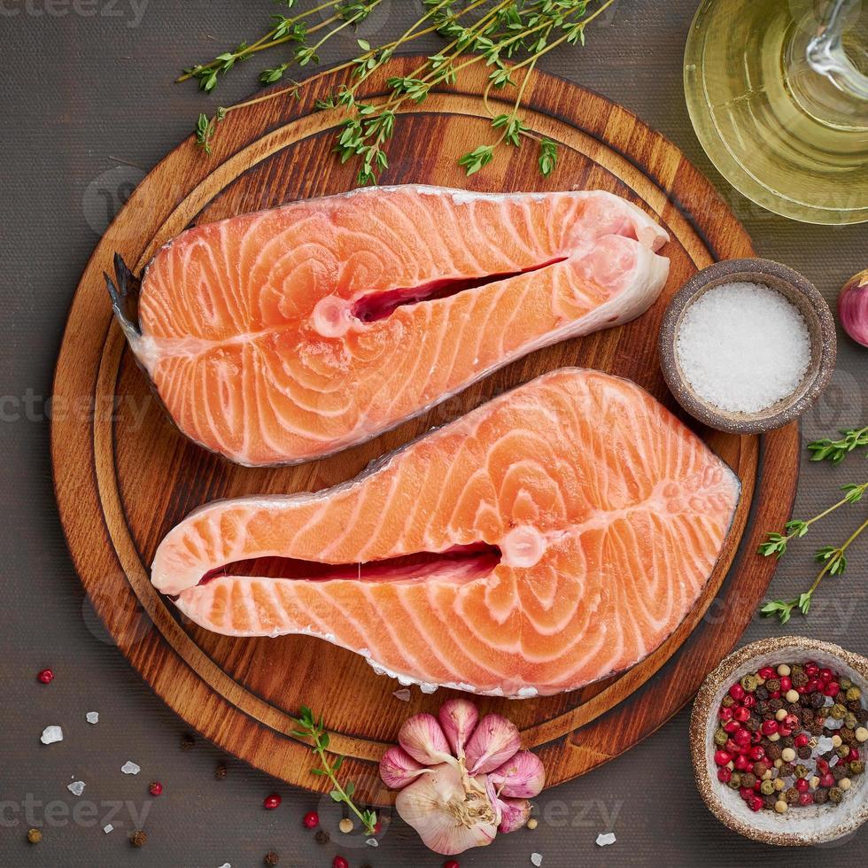 Two salmon steaks, top view, copy space. Fish fillet, large sliced portions on photo