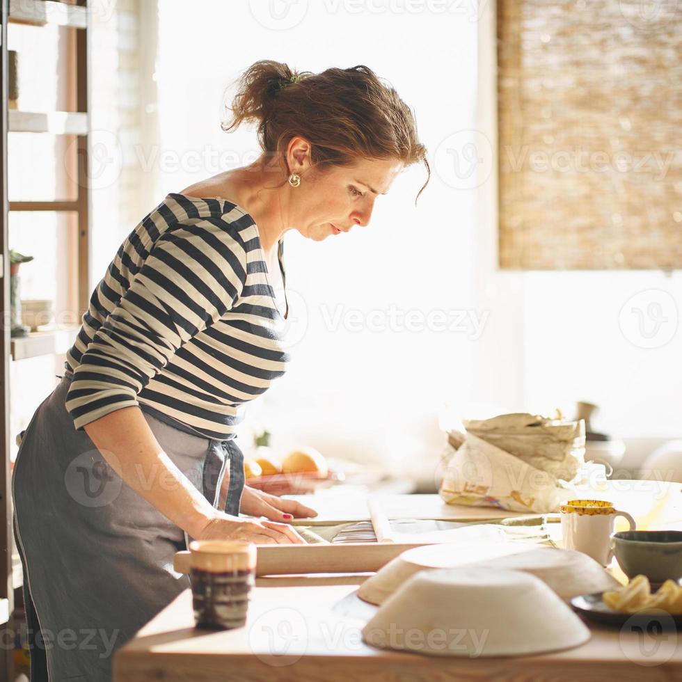 Woman freelance, business, hobby. Woman making ceramic pottery photo