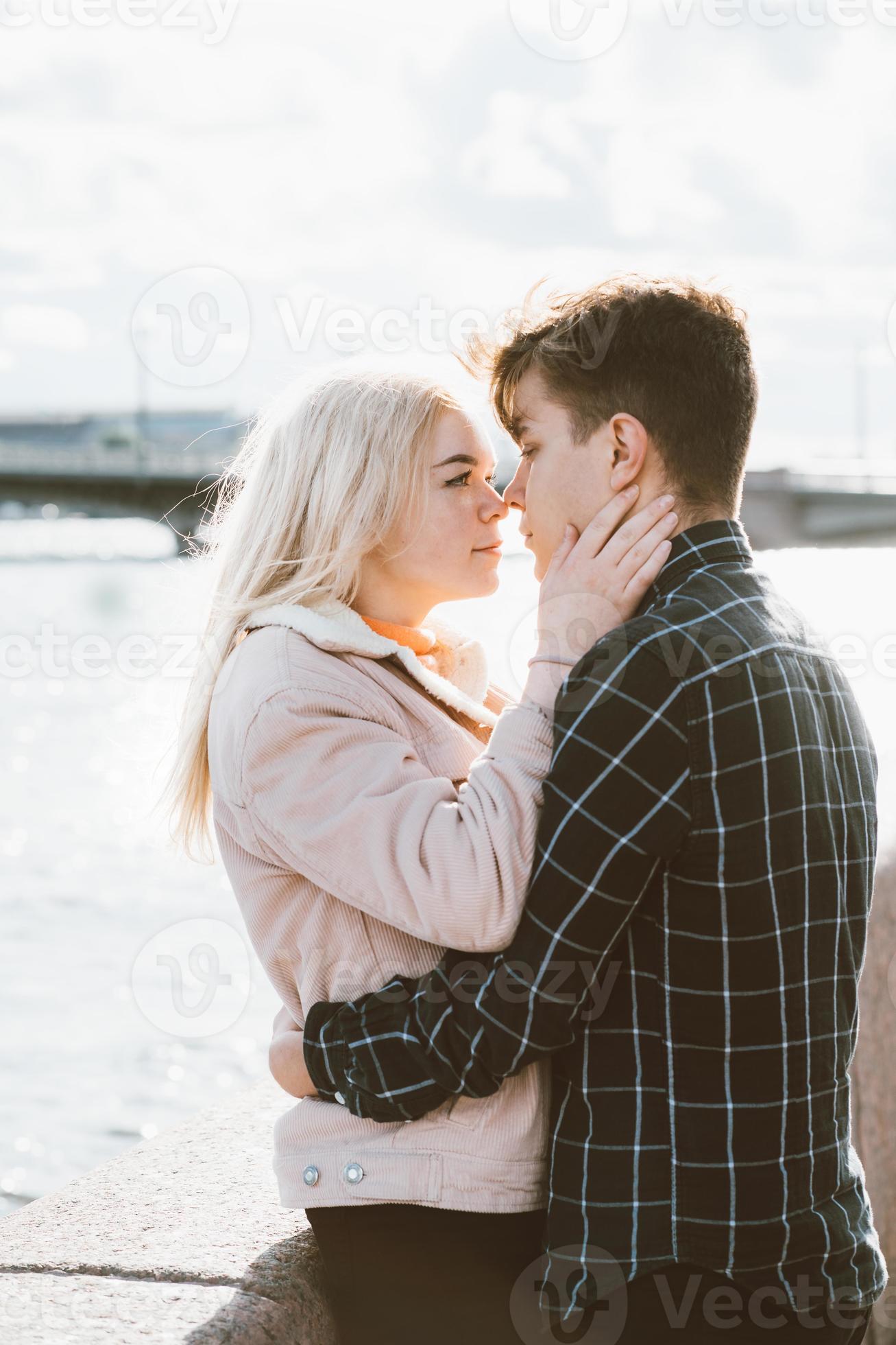 The boy looks tenderly at girl and wants to kiss. Concept of teenage love  and first kiss 7542624 Stock Photo at Vecteezy