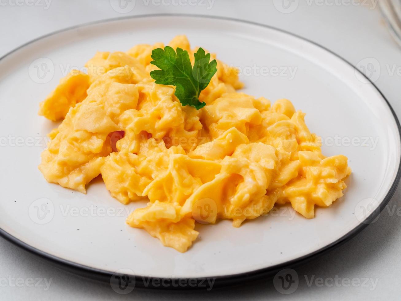 Scrambled eggs, Omelette. Breakfast with pan-fried eggs photo