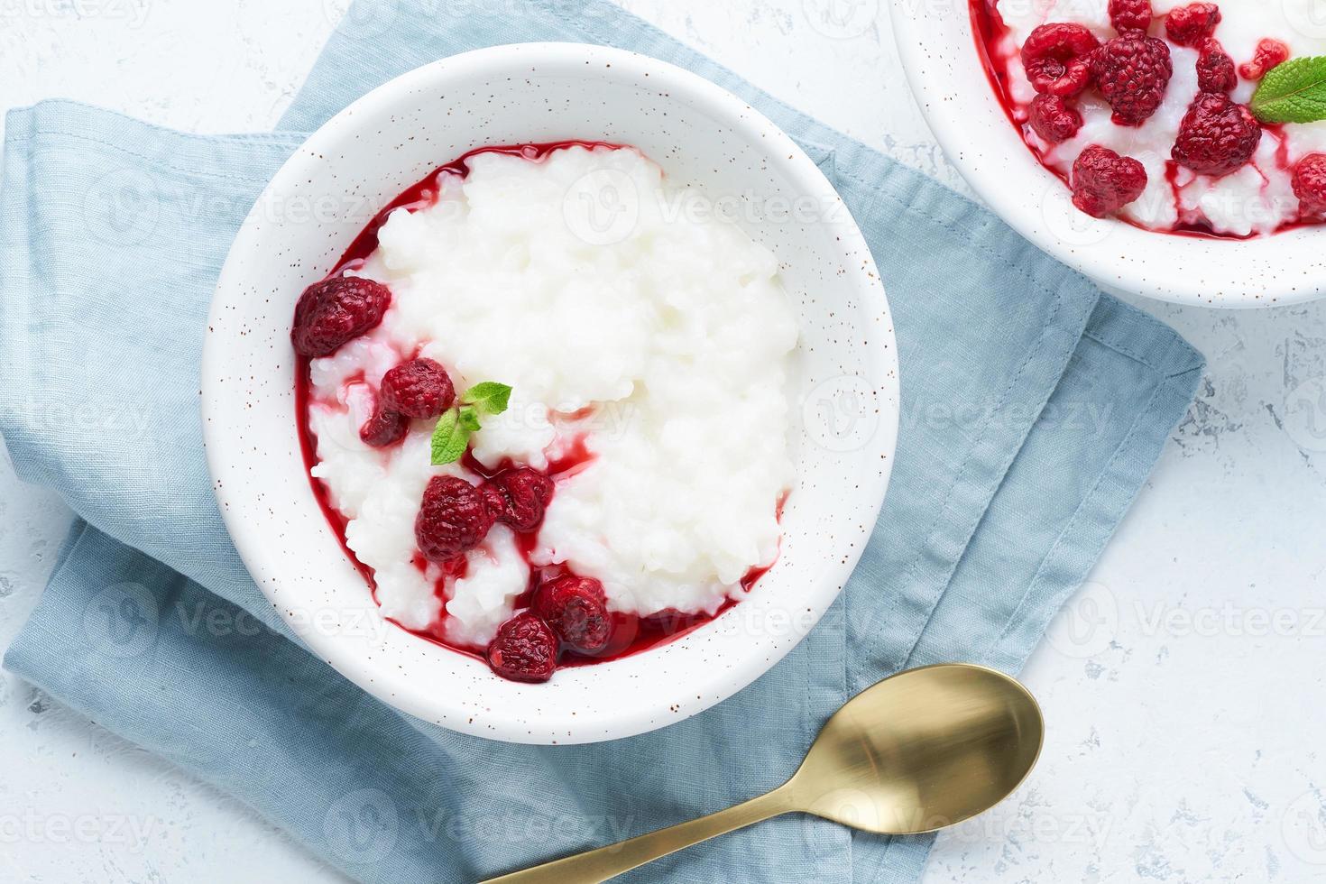 Rice Pudding. Long banner, Vegan Coconut diet breakfast with coconut milk, raspberry photo
