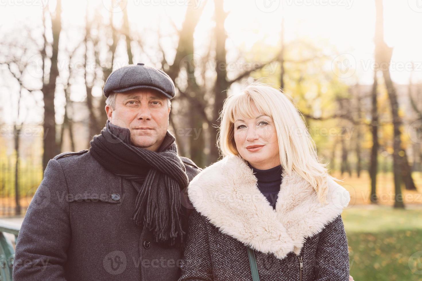 Happy blonde mature woman and handsome middle-aged brunette man photo