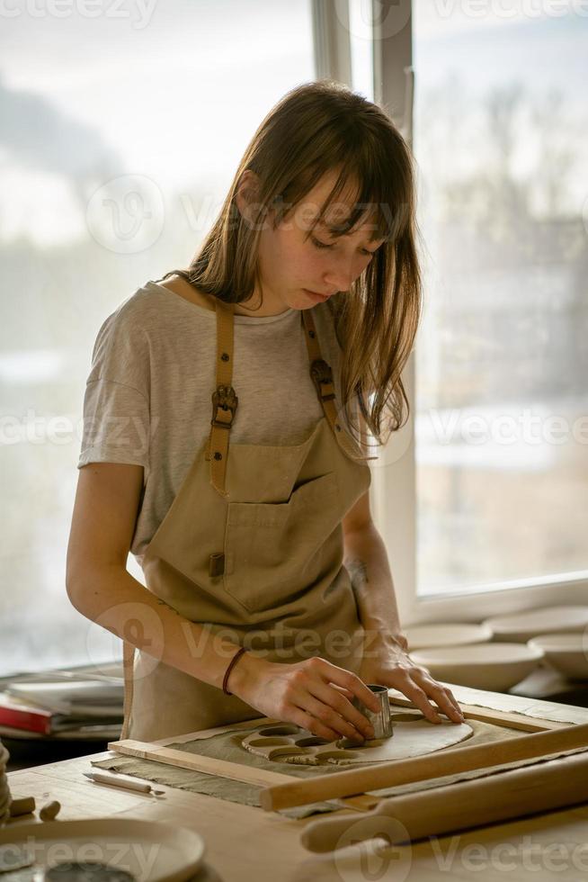 Woman freelance, business, hobby. Woman making ceramic pottery photo