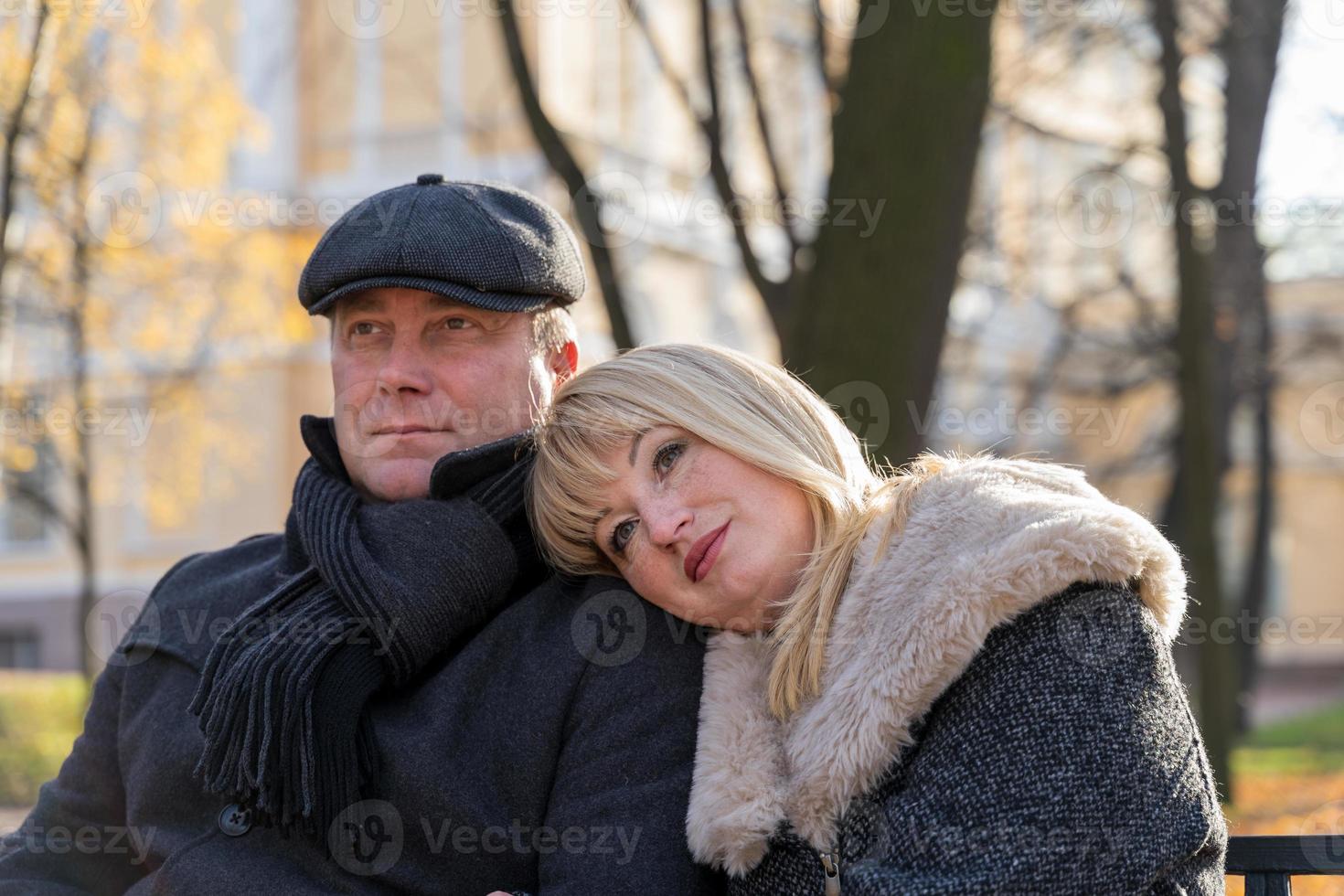 Happy blonde mature woman and handsome middle-aged brunette man photo