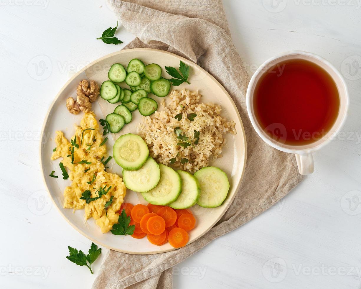 Balanced gluten free food, brown rice zucchini with scramble, dash fodmap diet photo