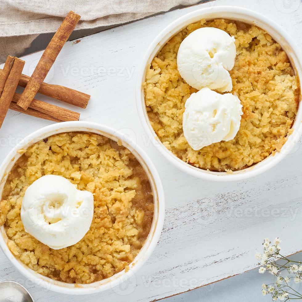 Apple crumble with the ice cream, streusel. Top view, close up photo