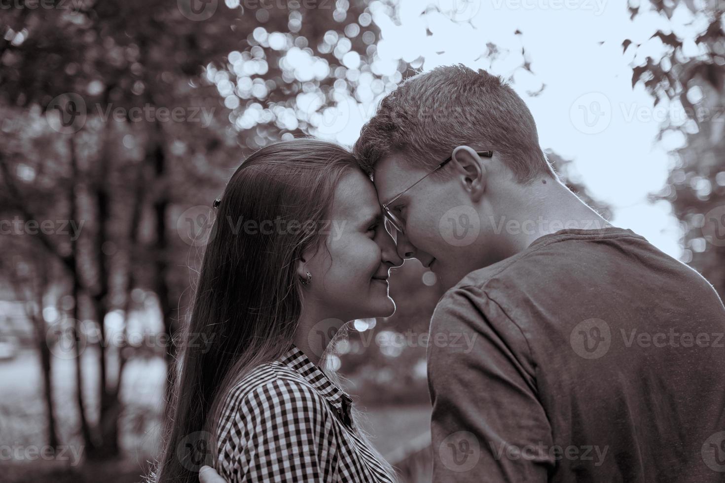 Teenagers are looking at each other closeup, black-and-white concept of love photo