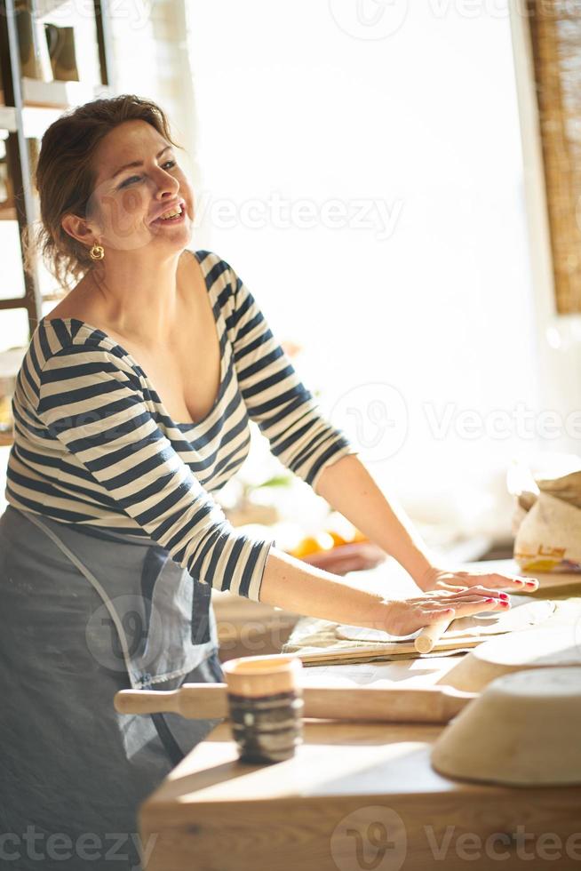 Woman freelance, business, hobby. Woman making ceramic pottery photo