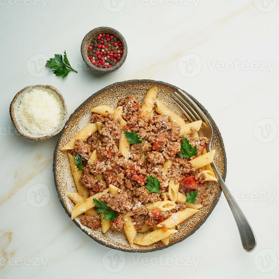 Bolognese pasta. Fusilli with tomato sauce, ground minced beef. photo