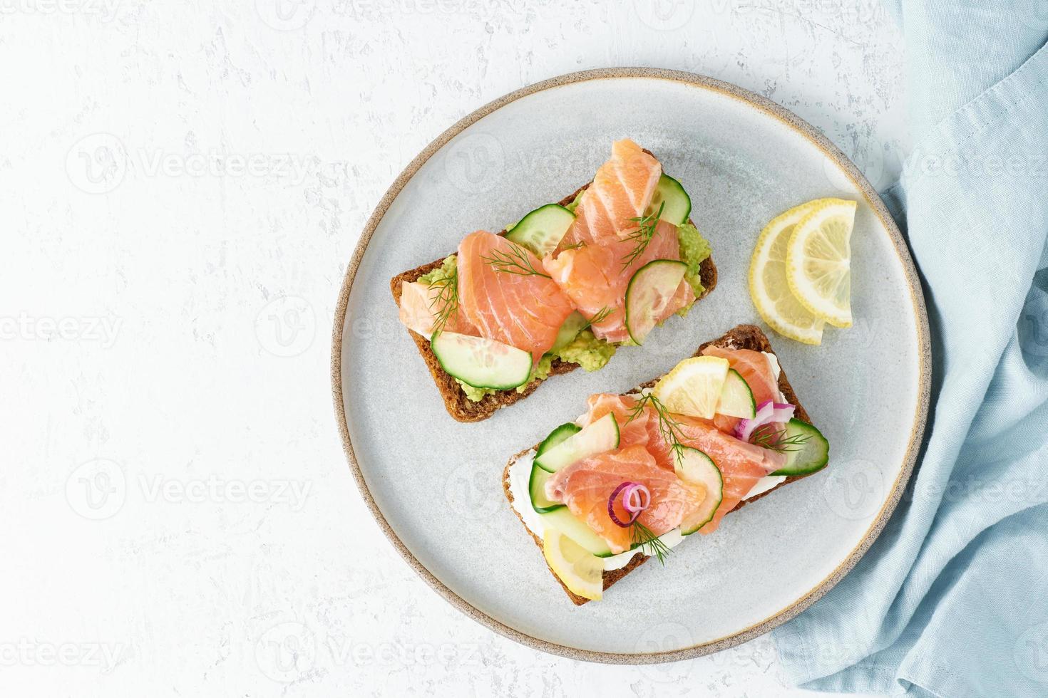 Savory fish smorrebrod, set of five traditional Danish sandwiches. Black rye bread photo