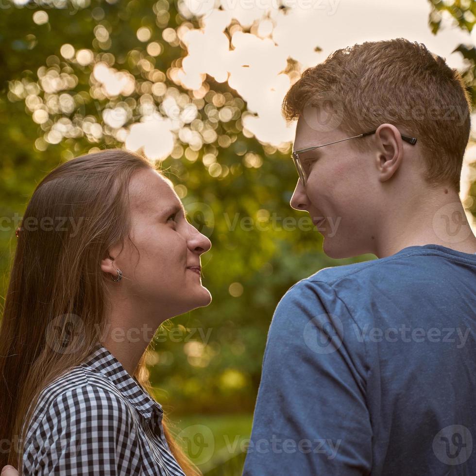 Girlfriend and Boyfriend are looking at each other in the park, concept of love and happiness photo