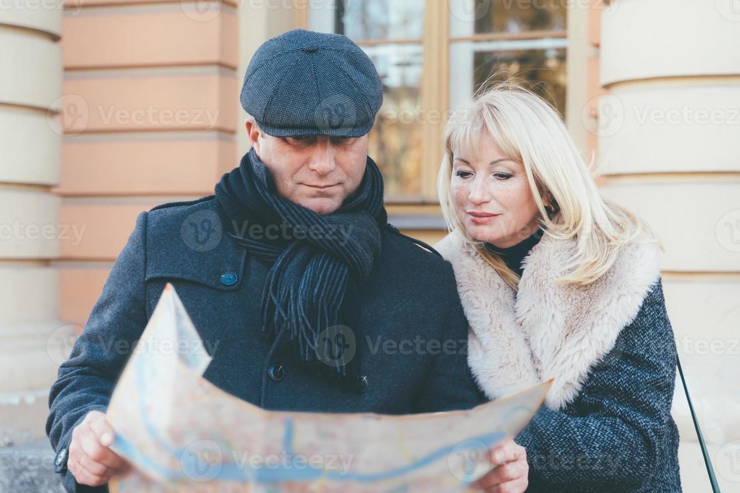 Happy blonde mature woman and handsome middle-aged brunette man photo