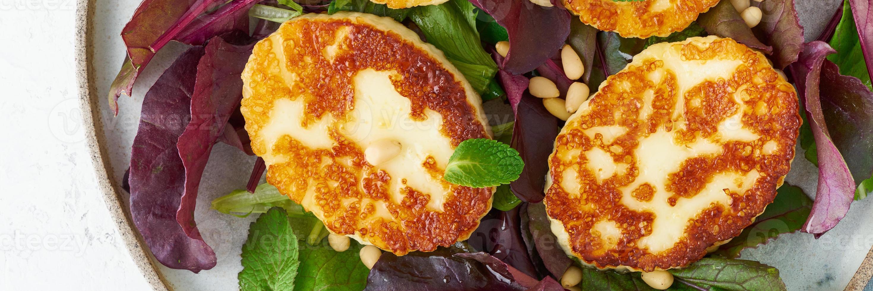 Cyprus fried halloumi with salad mix, beet tops. Lchf, pegan, fodmap, paleo, scd, keto photo