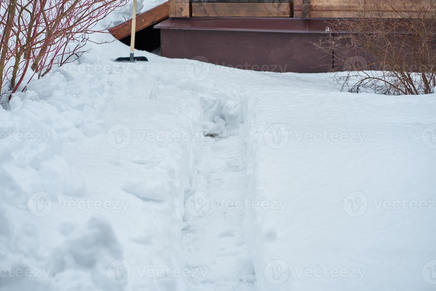 Rural rustic scene of winter in countryside, a lot of snow and a part of the house photo