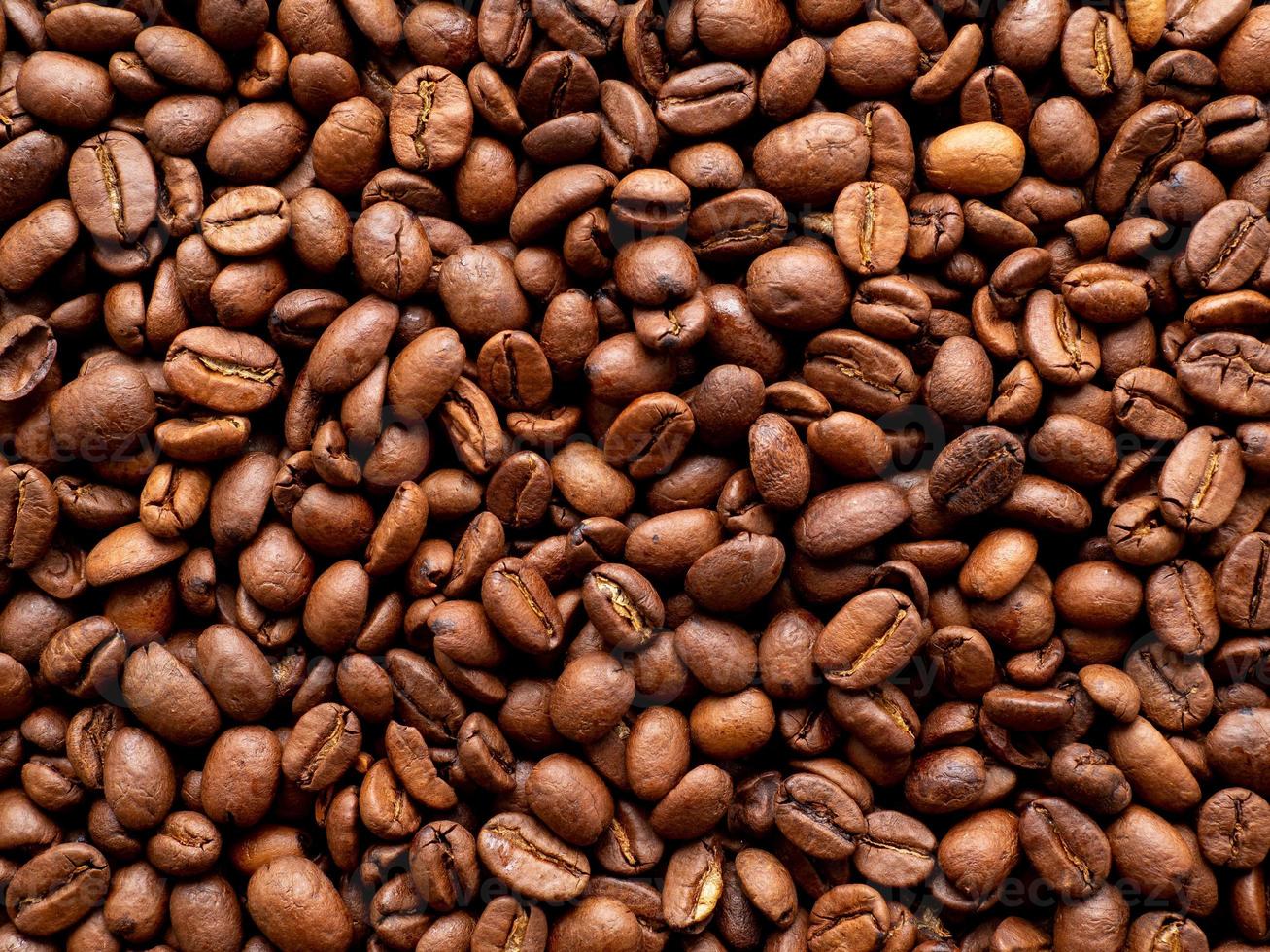 Close-up roasted coffee beans background, top view, copy space photo